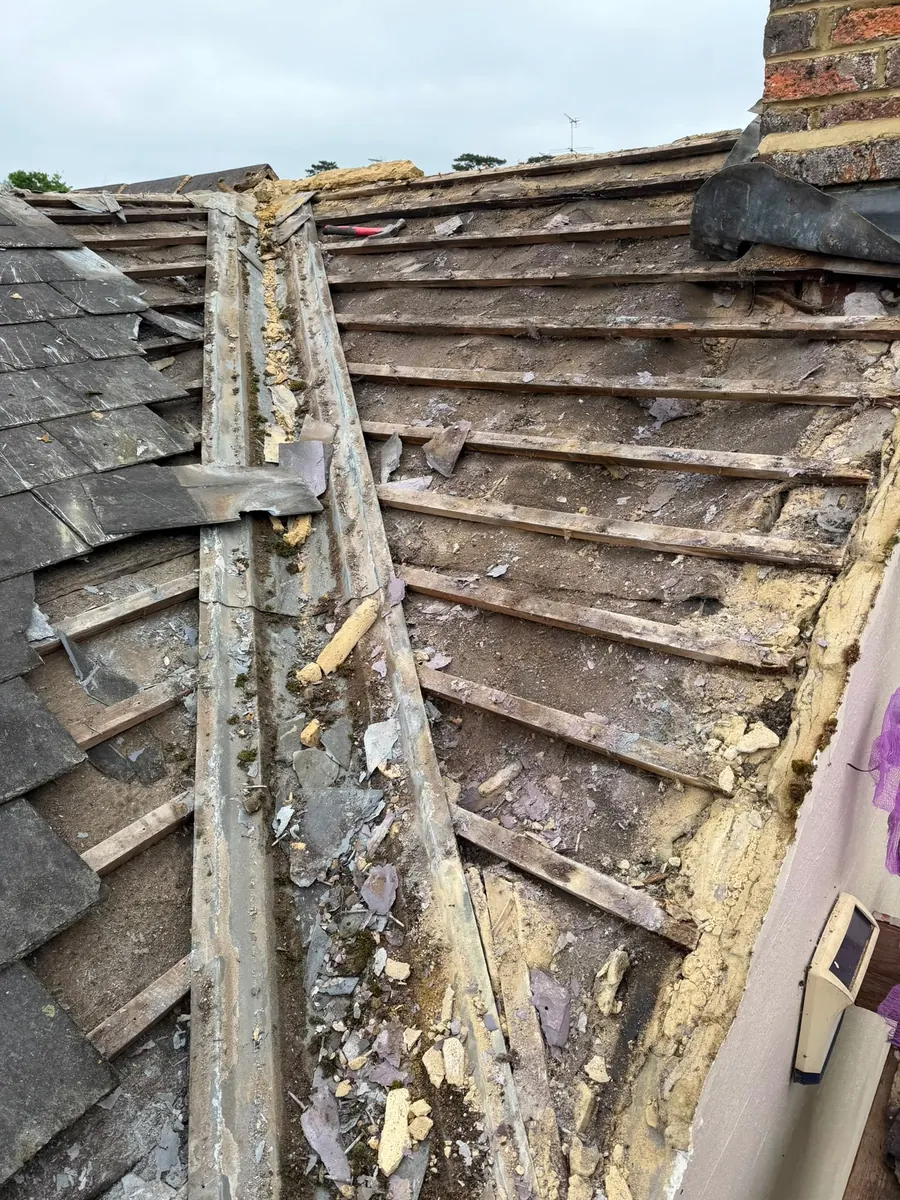 Old roof stripped back showing rotten battens, Dawn Roofs Ltd