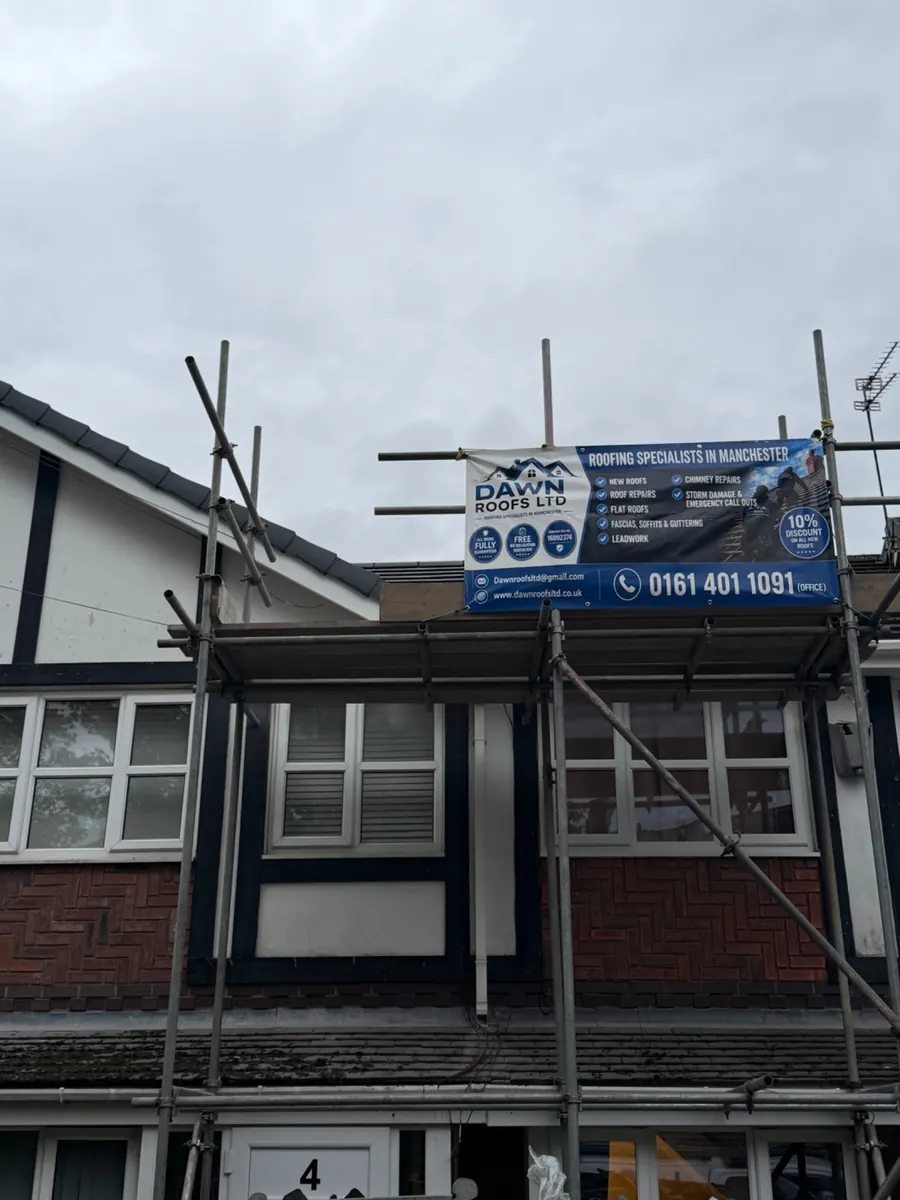 Scaffold up on a semi-detached house with the Dawn Roofs banner, Dawn Roofs Ltd