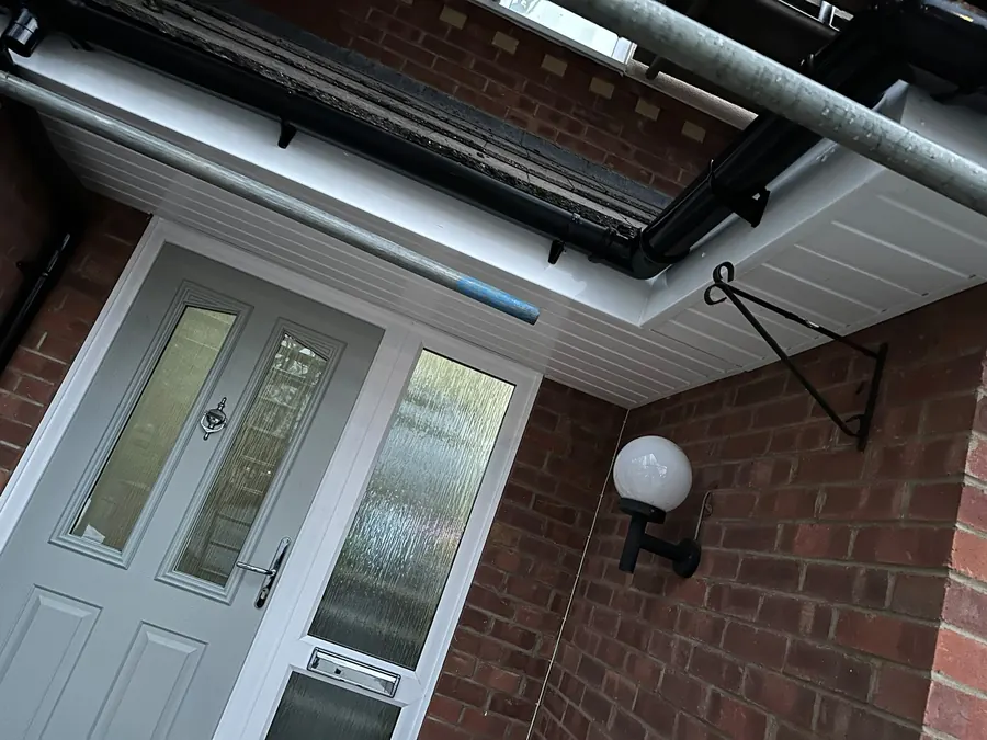 New white soffit and fascia over a front porch, Dawn Roofs Ltd
